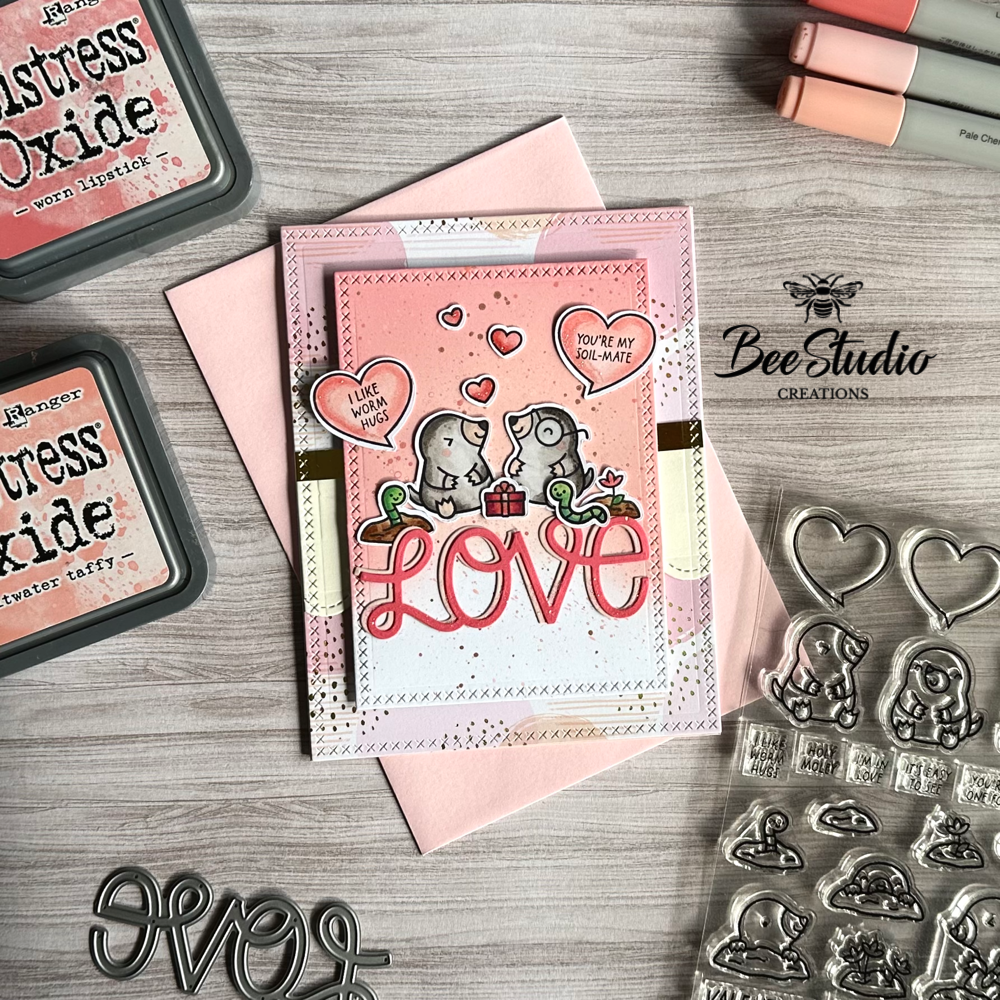 Love themed card featuring adorable moles.