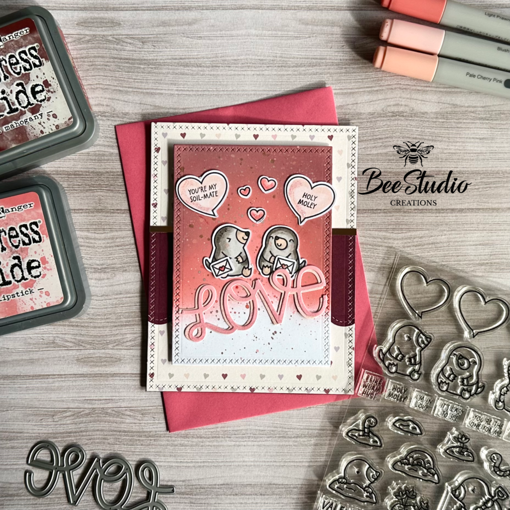 Love themed card featuring cute little moles. 